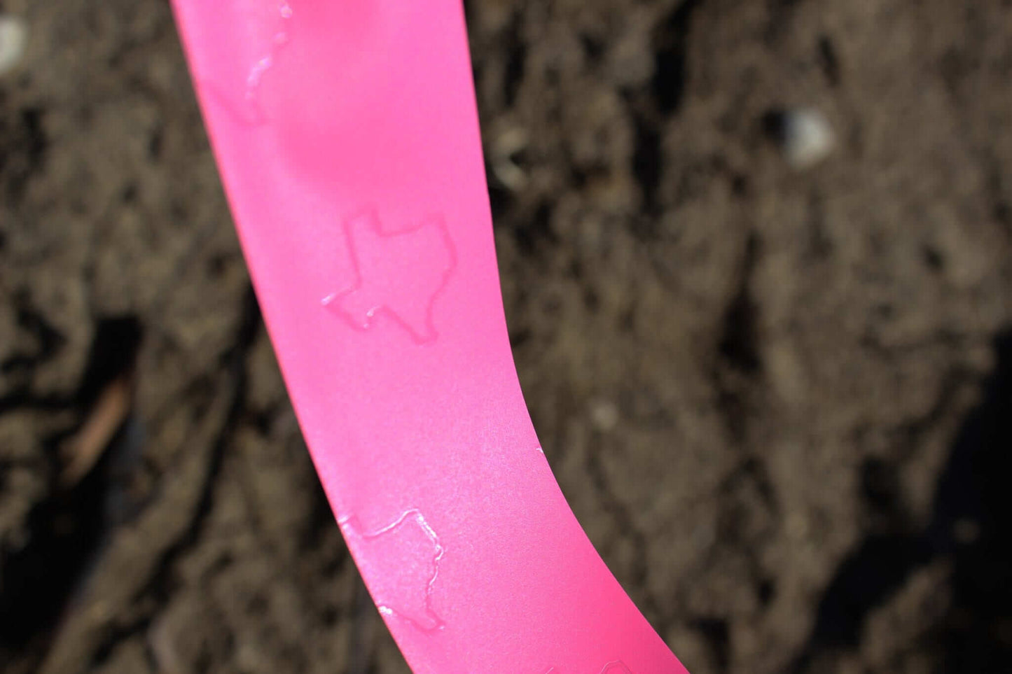 Presco Texas Flagging Tape PVC 1-3/16in x 150ft - in use field1 - Pink Glo TXPG