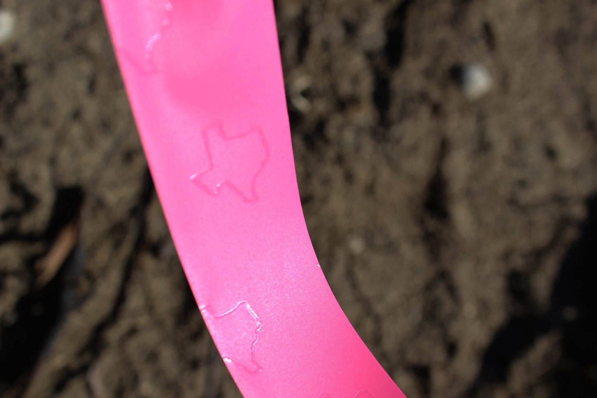 Presco Texas Flagging Tape PVC 1-3/16in x 150ft - in use field1 - Pink Glo TXPG