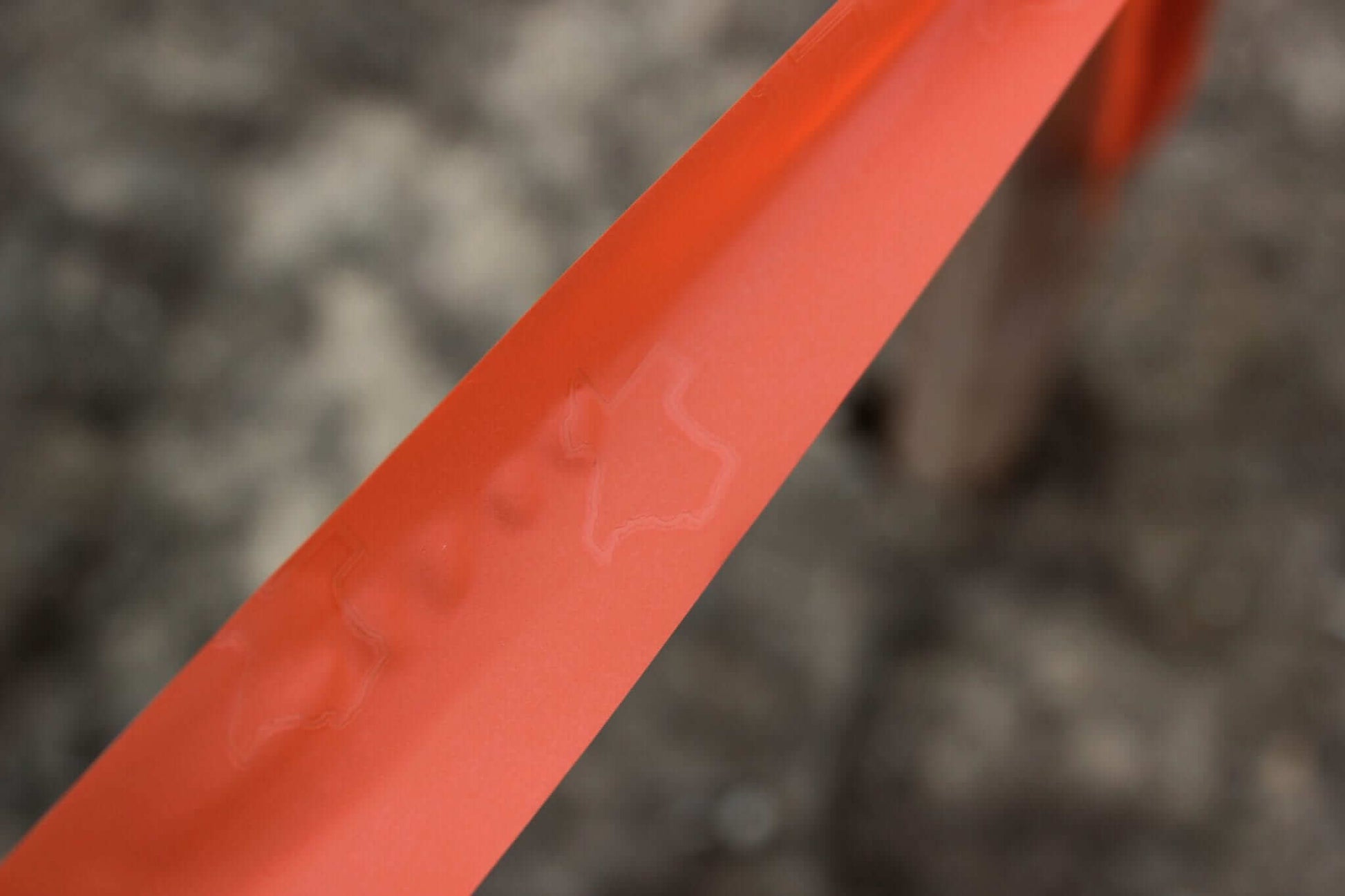 Presco Texas Flagging Tape PVC 1-3/16in x 150ft - in use field2 - Orange Glo TXOG